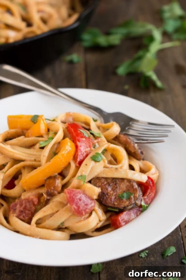 Overhead shot of Creamy Cajun Pasta with Smoked Sausage garnished with fresh parsley