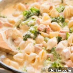 Ham and Broccoli Macaroni Gratin 2 A vibrant bowl of Ham and Broccoli Macaroni and Cheese, perfect for a hearty meal.