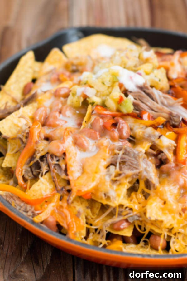 Hawaii's BEST pork nachos with an amazing pina colada sauce