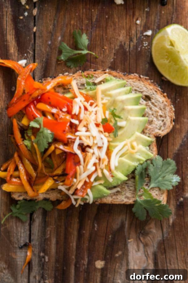 Fajita Avocado Toast: Quick Dinner Idea Vibrant Fajita Avocado Toast with seasoned peppers, cheese, and a squeeze of lime.