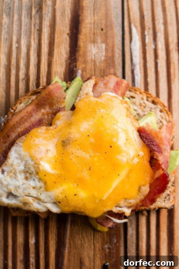 Cade's Favorite Bacon and Egg Avocado Toast Bacon and Egg Avocado Toast: A hearty and satisfying breakfast choice.