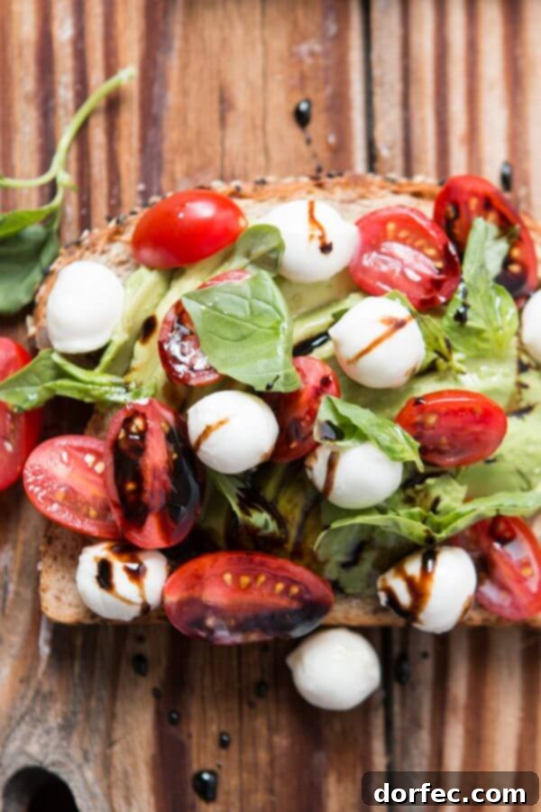 Caprese Avocado Toast with Balsamic Glaze Elegant Caprese Avocado Toast with balsamic glaze, mozzarella, and fresh basil.