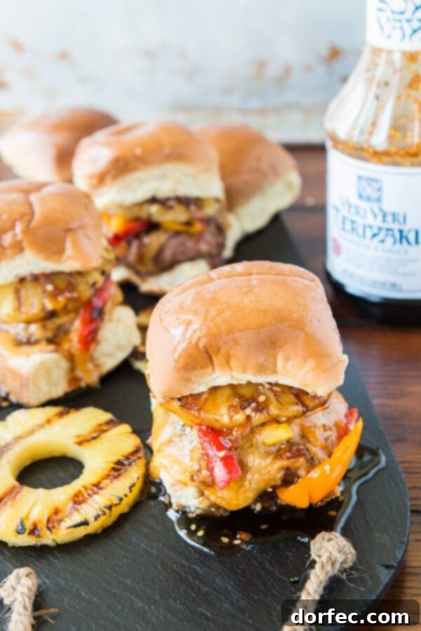 Irresistible Hawaiian Turkey Burger Sliders with Teriyaki Sauce and Pineapple Juicy Hawaiian Turkey Burger Sliders with melted cheese, grilled pineapple, and a generous drizzle of teriyaki sauce, ready to be devoured. A perfect summer meal.