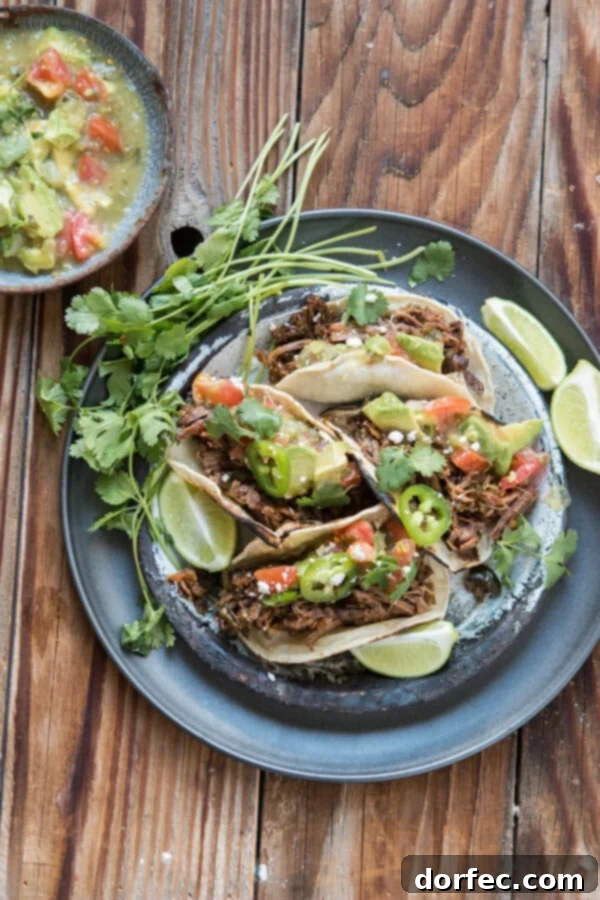Poblano Braised Beef Tacos for Taco Tuesday. Tender, flavorful beef is slow-cooked with poblano peppers for the best taco meat ever!