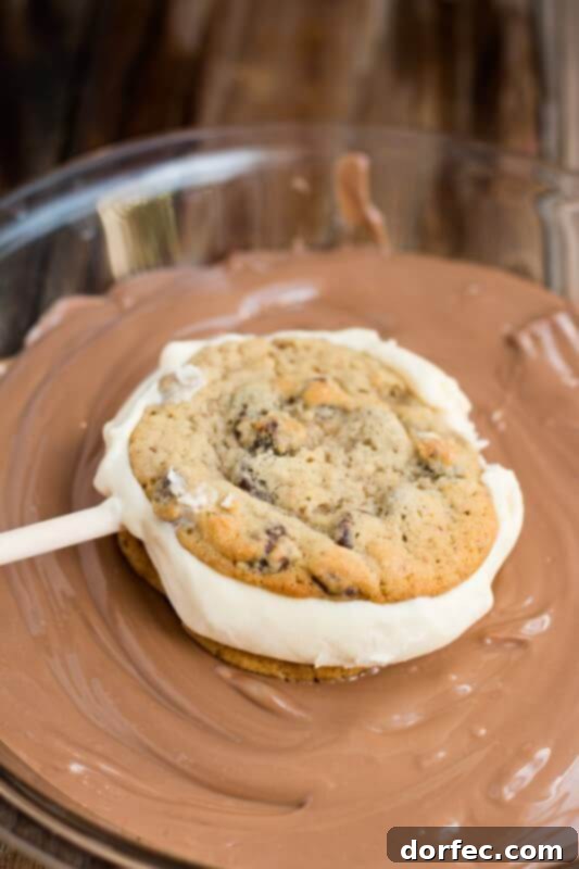 Chocolate chip cookie ice cream sandwiches dipped in chocolate ohsweetbasil.com