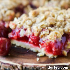 Cherry Crisp Bars ready to serve. ohsweetbasil.com