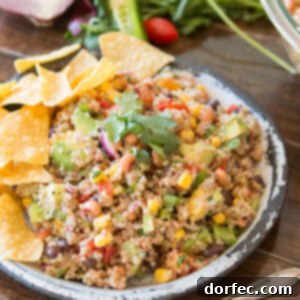 A vibrant and delicious Cowboy Caviar Quinoa Salad, perfect for healthy eating and entertaining. ohsweetbasil.com