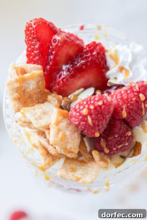 Family enjoying a relaxed movie morning with homemade Cinnamon Berry Crisp Yogurt Parfait and Mom's Best Cereals, fostering quality time.