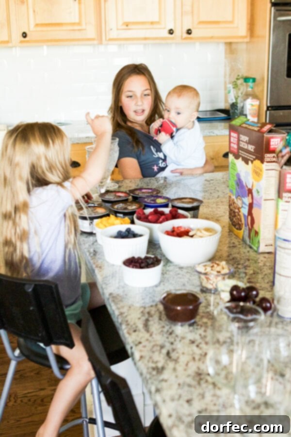 Healthy breakfast ideas for kids: Cinnamon Berry Crisp Yogurt Parfait made with Mom's Best Cereals for a special family movie morning.