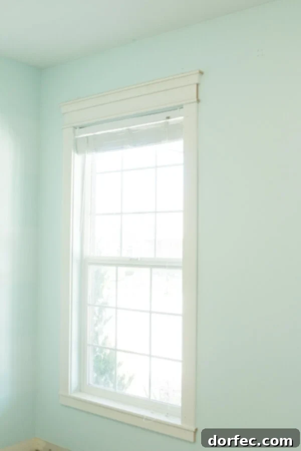 Close-up of newly installed bright white trim, complementing the warm Alabaster walls.