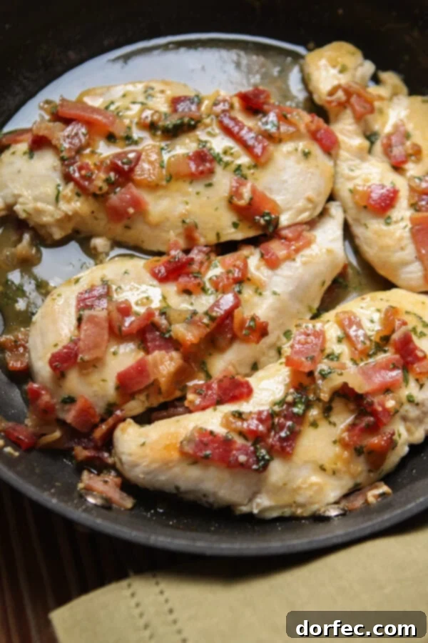 A beautiful close-up of the Honey Mustard Bacon Chicken Skillet, highlighting the golden chicken, crispy bacon, and luscious sauce, an ideal healthy one-pan dinner.