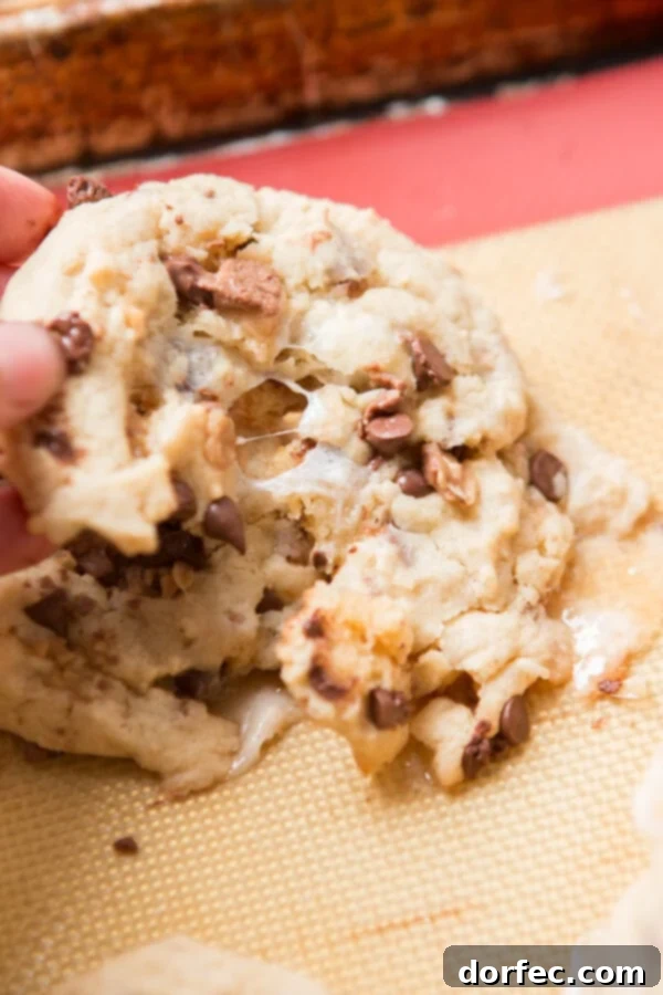 Mixing the Perfect Cookie Dough with Country Crock Hands mixing cookie dough in a bowl, showcasing the creamy texture of the batter for marshmallow toffee cookies.