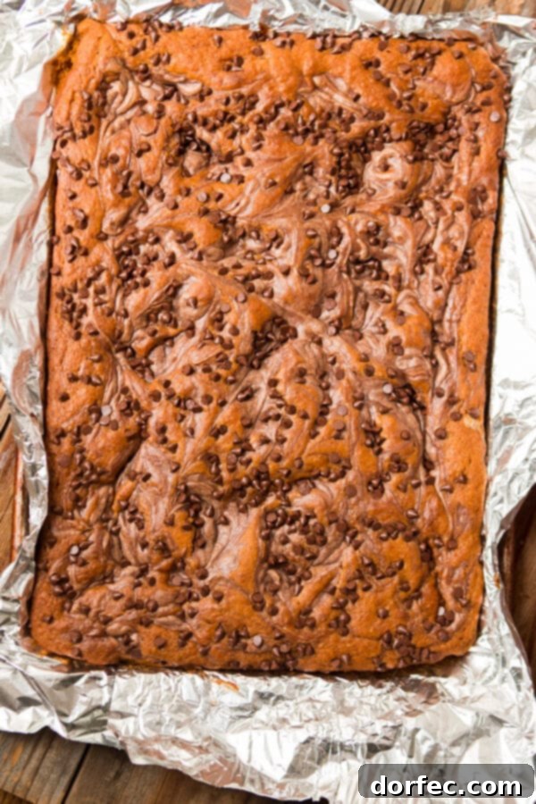 Easy to make pumpkin bars with a delicious Nutella cream cheese swirl.