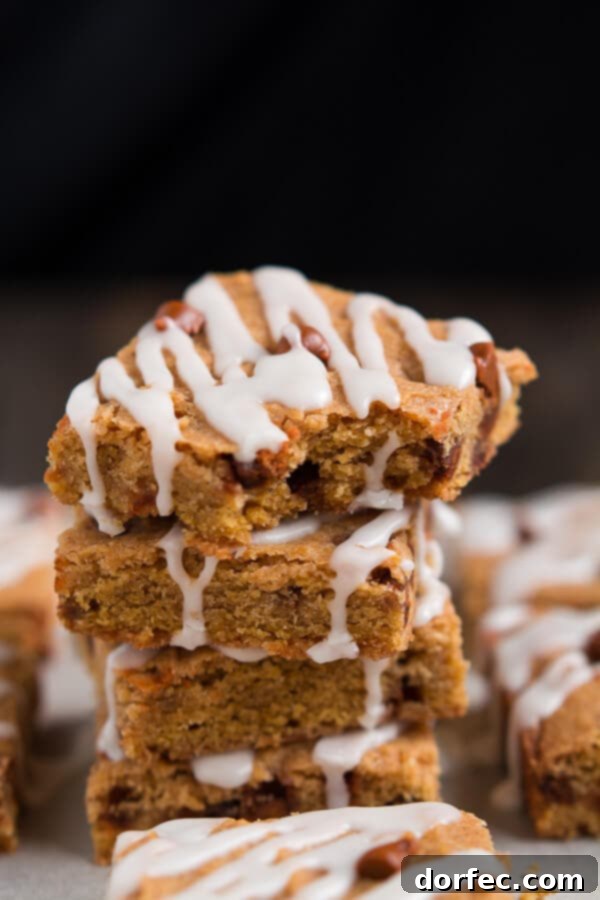 Close-up view of Cinnamon Pumpkin Cookie Bar dough studded with sweet cinnamon chips before baking