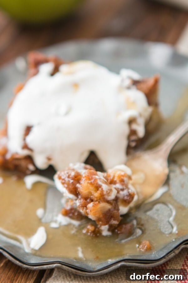Close-up of caramel sauce being poured over apple cake, a truly indulgent sight