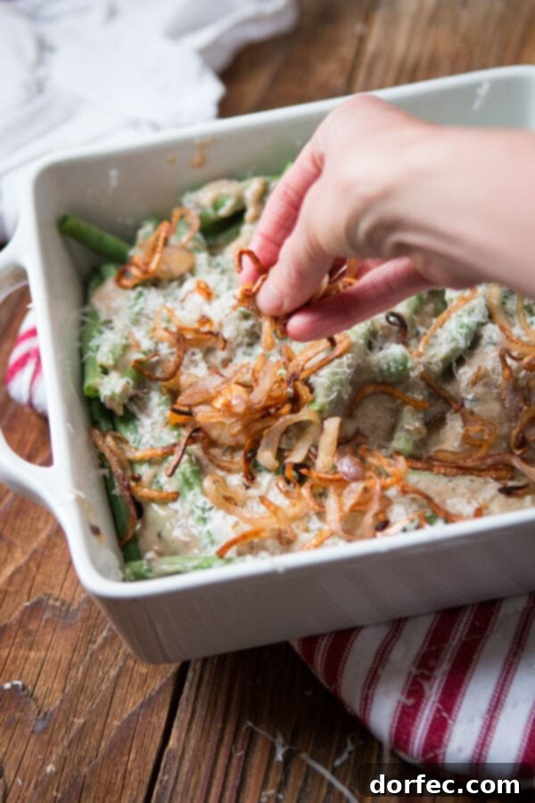We all grew up on green bean casserole with cream of mushroom soup, but it's time to kick things up with Heritage Green Bean Casserole with Crispy Shallots. ohsweetbasil.com