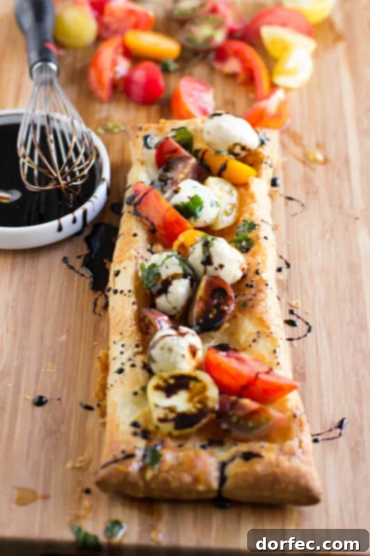 Heriloom-tomatoes-puff-pastry-marinated-mozzarella-and-balsamic-reduction-and-guess-what-all-of-it-is-premade-and-you-can-whip-it-all-together.-ohsweetbasil.com_-4-533x800