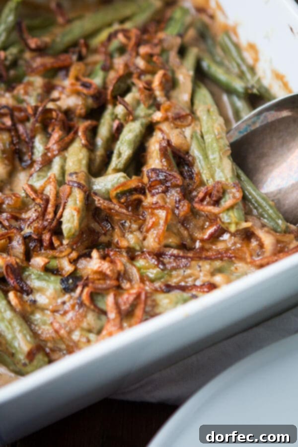 We all grew up on green bean casserole with cream of mushroom soup, but it's time to kick things up with Heritage Green Bean Casserole with Crispy Shallots. ohsweetbasil.com