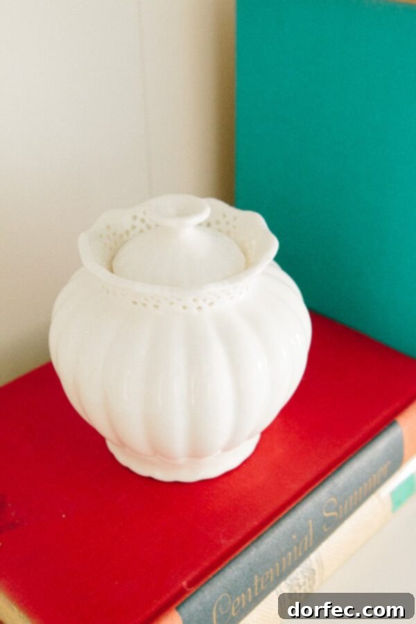 Every detail carefully selected to create a harmonious office environment. A curated bookshelf featuring unique decor and vintage book finds