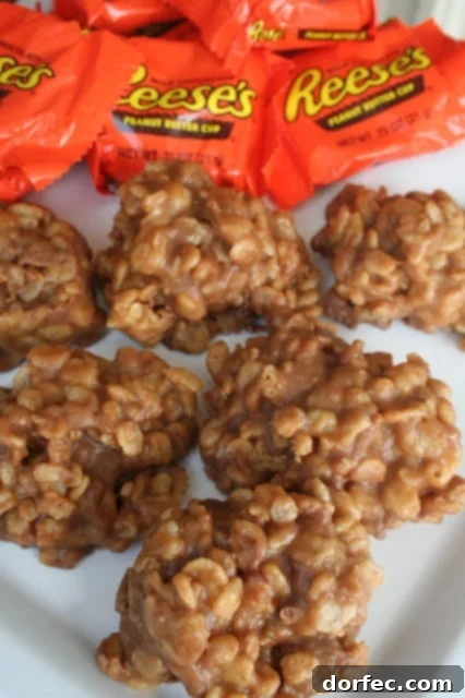 A child proudly displaying a handful of Reese's Krispies treats.