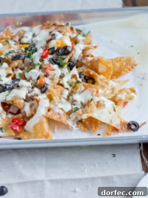 A rustic wooden board laden with Italian Nachos, showcasing the rich colors and textures of the dish, ready to be enjoyed.