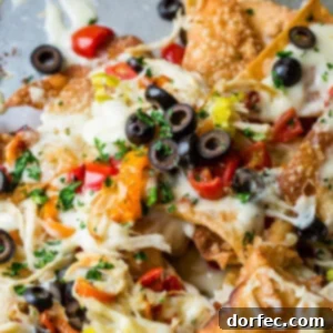 A top-down view of a serving of Italian Nachos with all the delicious toppings.