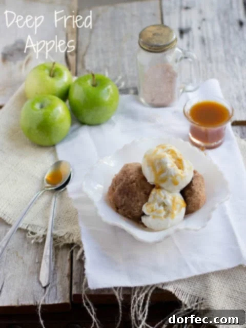 Sweet Skillet Apples 4 A serving of golden fried apples, garnished with a dollop of vanilla ice cream and a drizzle of caramel sauce