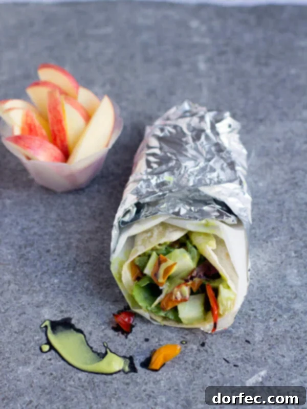 Close-up of a Honey Avocado Wrap filled with fresh ingredients and creamy dressing, perfect for a quick and healthy lunch.
