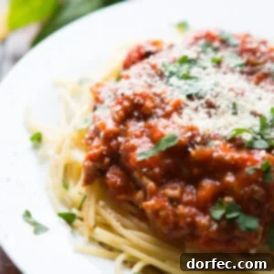 Homemade spaghetti sauce on a white plate