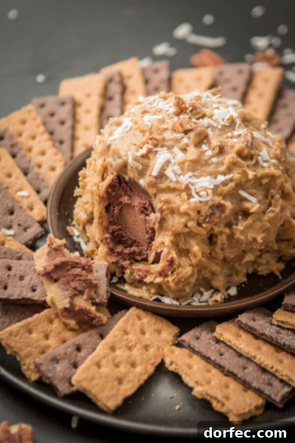 Love German chocolate cake? Especially that sticky coconut frosting? This German Chocolate Cake Cheese Ball is way easier than cake but just as delicious! ohsweetbasil.com