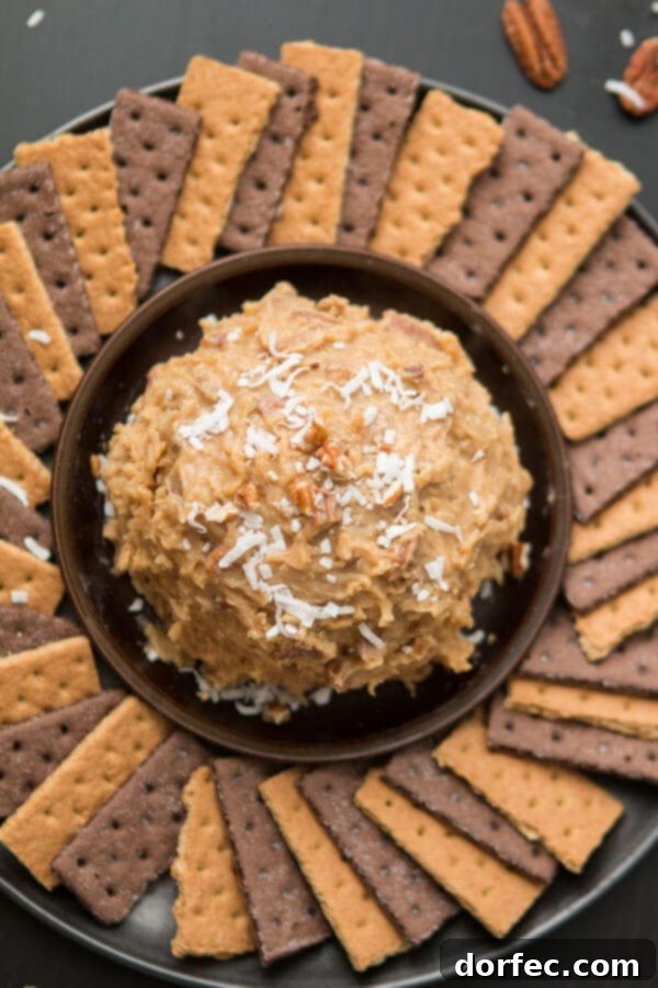Love German chocolate cake? Especially that sticky coconut frosting? This German Chocolate Cake Cheese Ball is way easier than cake but just as delicious! ohsweetbasil.com