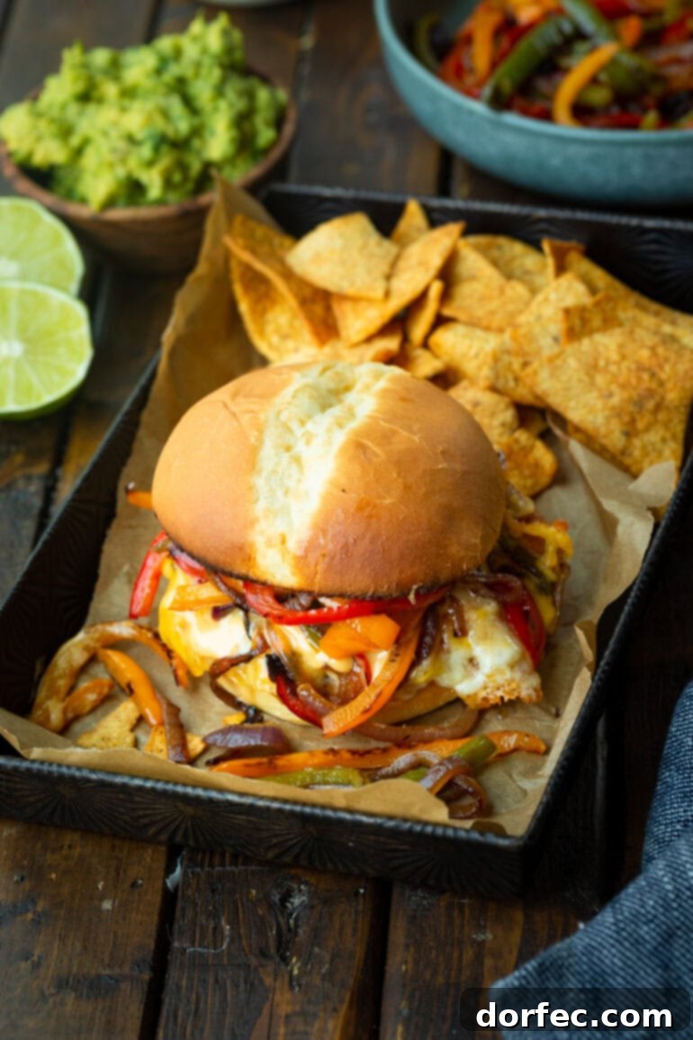 Sizzling Mexican Fajita Burgers 6 A delectable fajita burger overflowing with melted gooey cheese, caramelized peppers and onions, and a creamy sauce, with a backdrop of crispy tortilla chips.