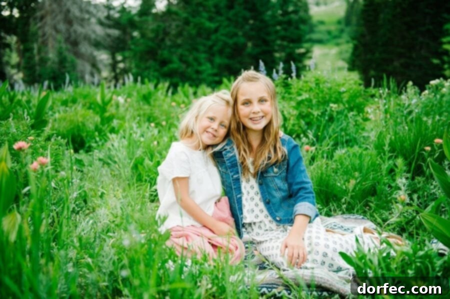 12 Precious Moments to Create With Your Daughter Before She's Grown 15 Two sisters smiling warmly, showcasing their loving bond.