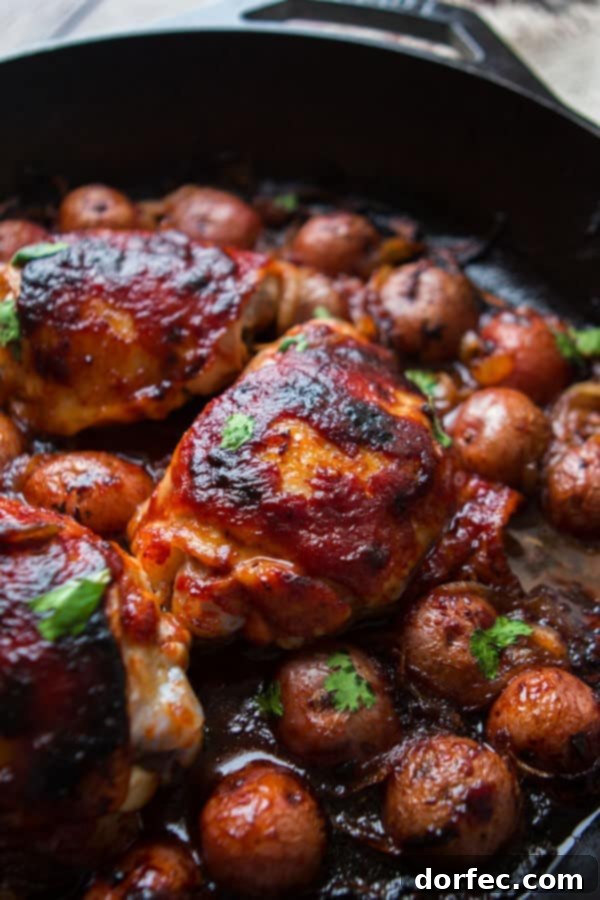A beautifully cooked one-skillet BBQ chicken and potatoes dish, showcasing tender chicken, caramelized onions, and perfectly roasted potatoes for a delightful make-ahead dinner.