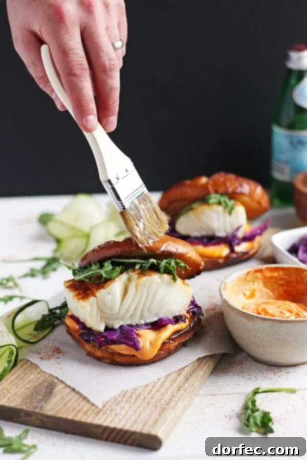 Healthy Fish Burger Recipe for Weeknights Another view of the quick and easy blackened fish burger, highlighting its vibrant colors and delicious sriracha mayo.