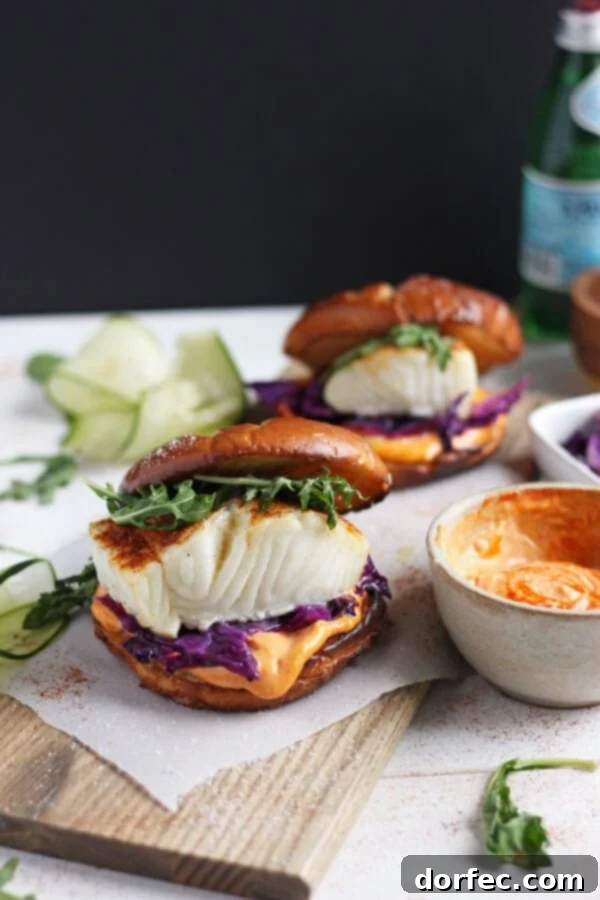 Blackened Fish Burger with Sriracha Mayo Feast Table spread with a blackened fish burger and various delicious side dishes, ready for a family meal.