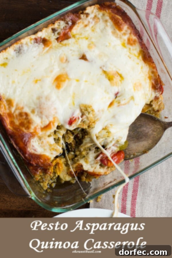 Delicious baked quinoa with pesto, roasted asparagus, tomatoes, and melted mozzarella cheese.