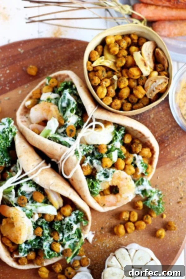 Delicious Roasted Chickpea Pita for a Healthy Meal A vibrant roasted chickpea and garlic caesar salad pita, showcasing fresh ingredients.