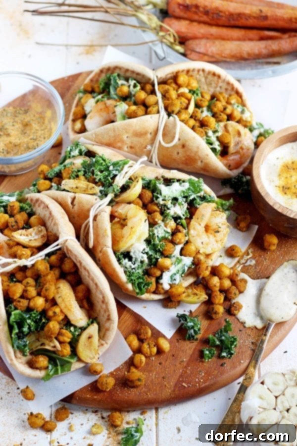 Filling for Roasted Chickpea Caesar Pitas Close-up of a roasted chickpea and garlic caesar salad pita, showing the delicious filling.