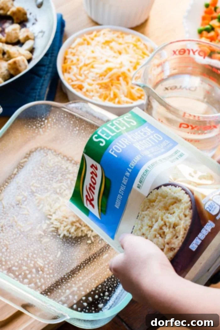Knorr Selects Four Cheese Risotto being poured into a greased baking dish, preparing for the Cheesy Chicken and Rice Casserole bake.