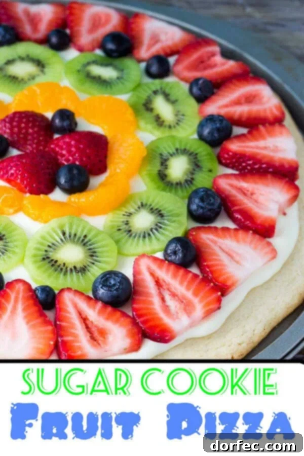 A beautifully arranged sugar cookie fruit pizza, vibrant with fresh fruit, ready to be served as a delightful and easy spring or summer dessert.
