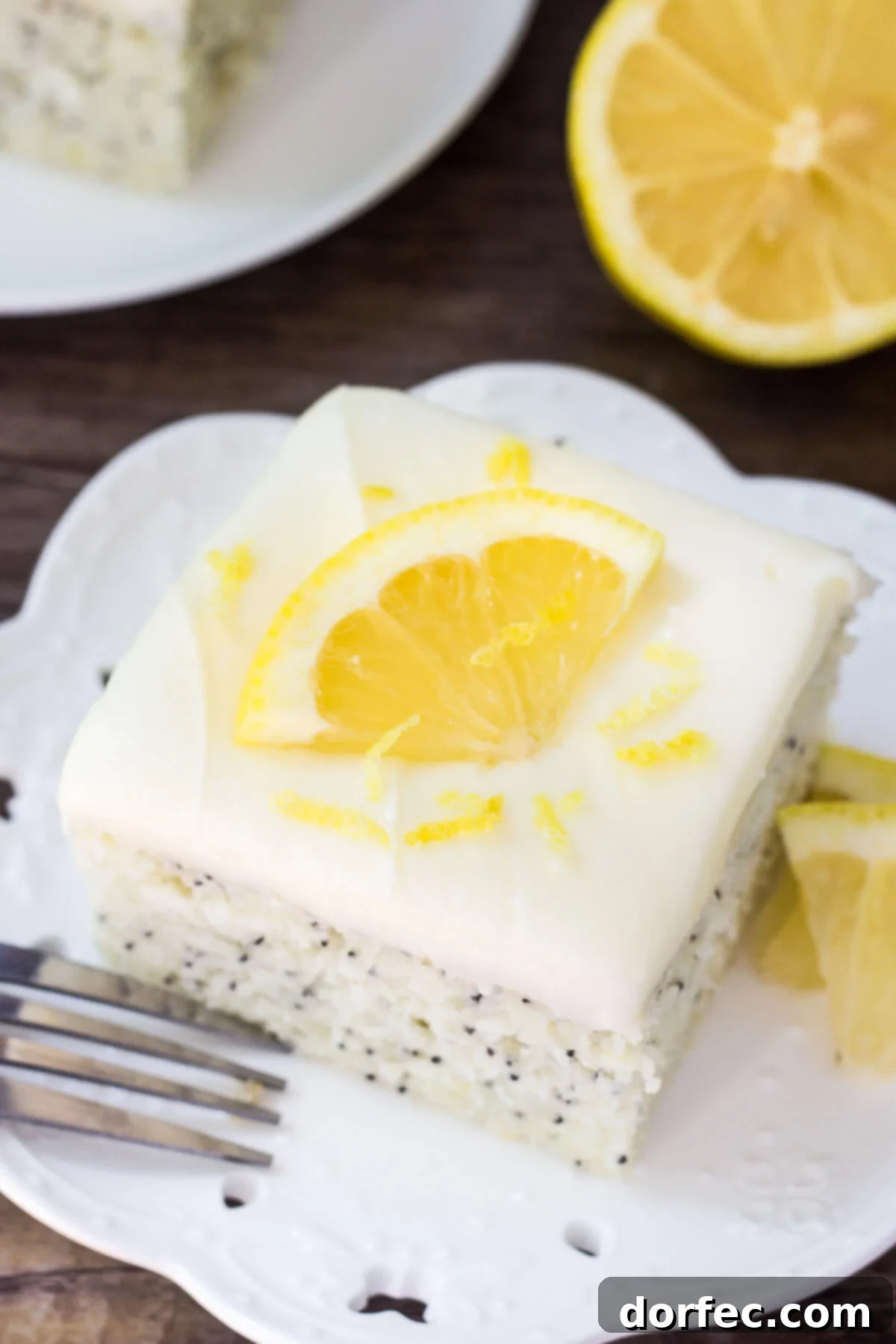 This Lemon Poppy Seed Cake with Cream Cheese Frosting is soft, moist & deliciously buttery with a fresh lemon flavor. Dotted with poppy seeds & topped with cream cheese frosting - it's the perfect dessert for lemon lovers! This Lemon Poppy Seed Cake with Cream Cheese Frosting is soft, moist & deliciously buttery with a fresh lemon flavor. Dotted with poppy seeds & topped with cream cheese frosting - it's the perfect dessert for lemon lovers!