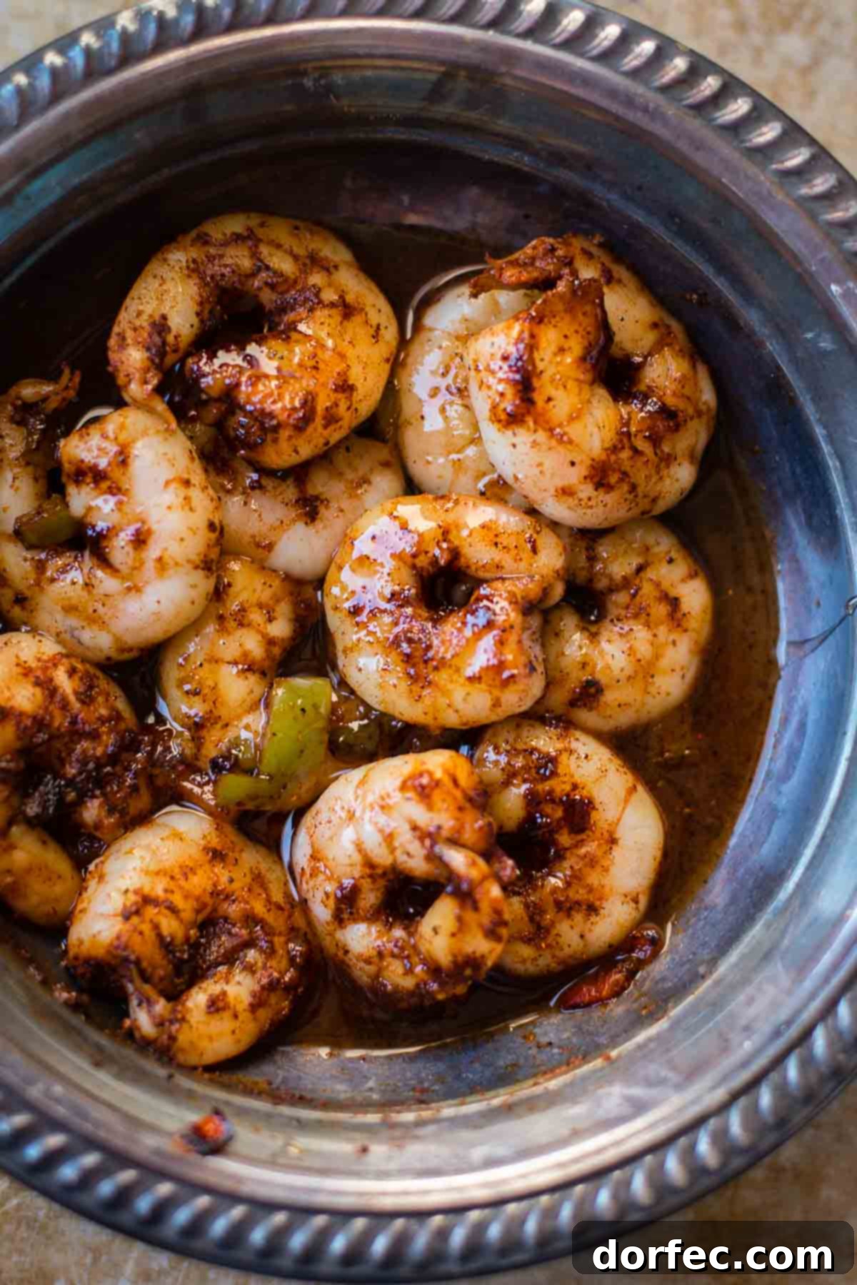 Close-up of Sticky Honey Lime Shrimp on skewers, showing the rich glaze and seasoning
