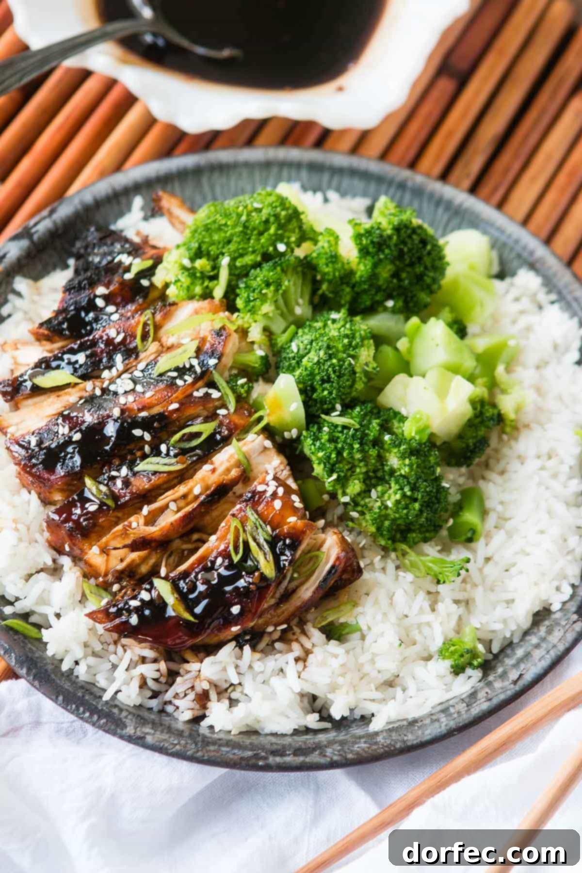 Sticky Asian Grilled Chicken Breasts - A delicious, family-friendly dinner Plated Sticky Asian Grilled Chicken Breasts with rice and garnishes