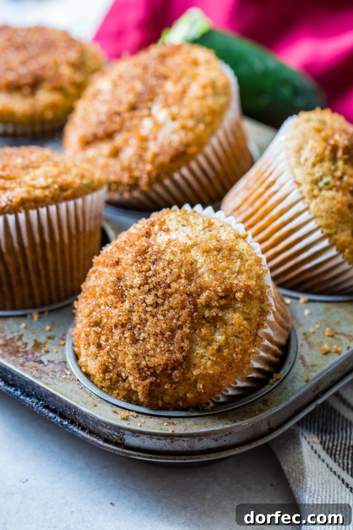 Mom's best zucchini muffins only need a few ingredients but the sour cream is the most important part. Looking for recipe ideas using zucchini? Make these muffins! 6 homemade zucchini muffins in muffin tin