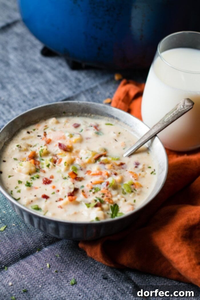 Rich and creamy One Pot Cauliflower Chowder, brimming with tender carrots, flavorful broth, healthy cauliflower, and savory bacon, making an easy and satisfying soup.