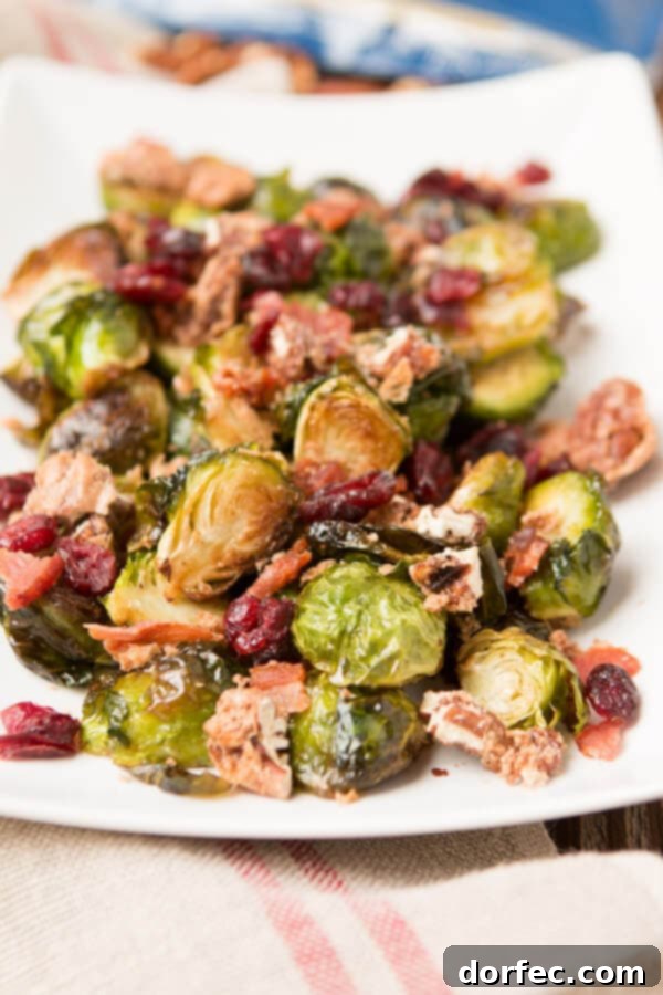 A festive holiday side dish featuring candied pecans, crispy bacon, and perfectly roasted brussels sprouts.