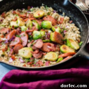 A vibrant one-skillet dish featuring cheddar broccoli rice and savory kielbasa, perfect for a quick family meal.