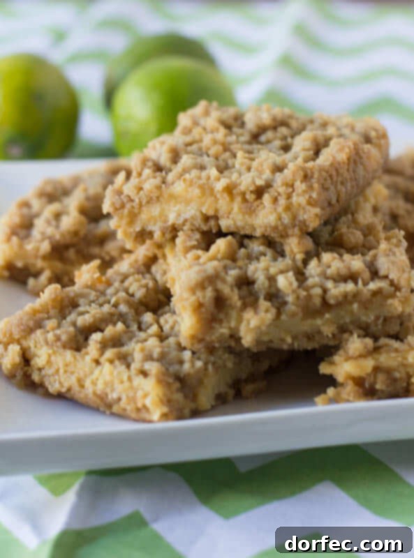 Delicious Key Lime Crumble Bars with a creamy, tart filling and buttery oat crumble topping, perfect for summer.