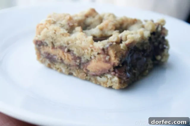 A tray of Reese's Crumble Bars cooling, ready to be sliced and enjoyed.